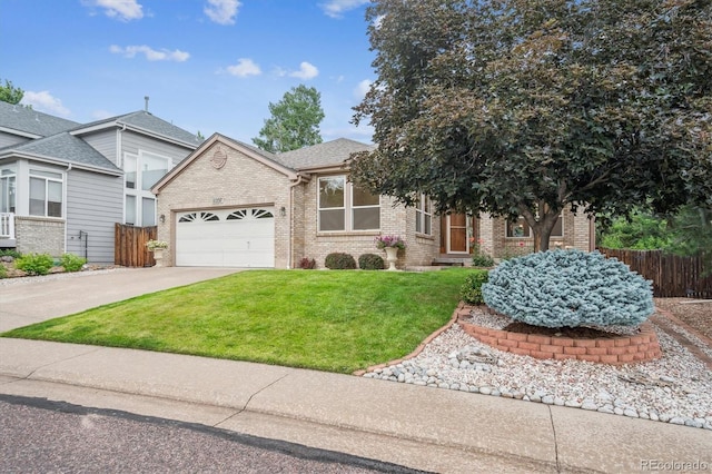 11237 W Ford Dr, Lakewood, CO 80226 - view of front of home with brick siding, a garage, and concrete driveway