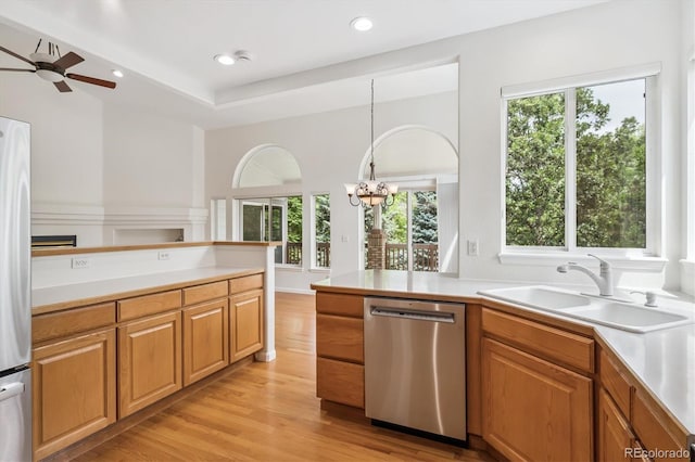 11237 W Ford Dr, Lakewood, CO 80226 - kitchen with stainless steel dishwasher, healthy amount of natural light, light countertops, and recessed lighting