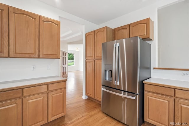 11237 W Ford Dr, Lakewood, CO 80226 - kitchen with stainless steel fridge, light countertops, and light wood-type flooring