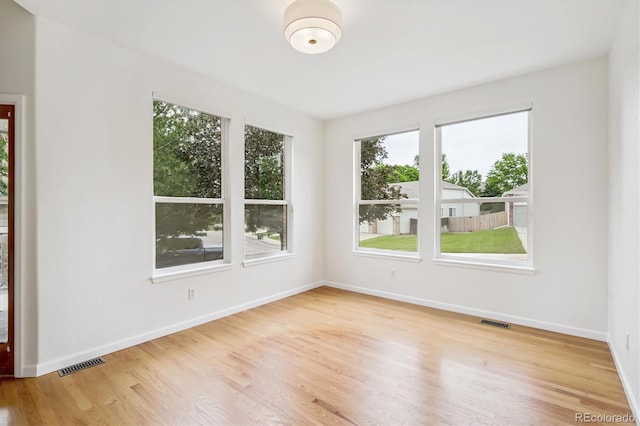 11237 W Ford Dr, Lakewood, CO 80226 - spare room featuring wood finished floors and baseboards