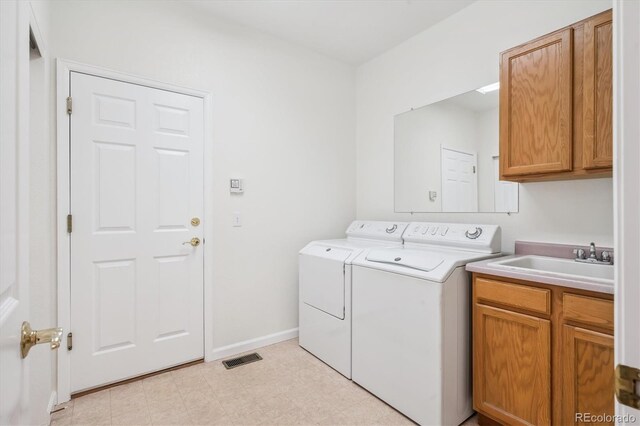11237 W Ford Dr, Lakewood, CO 80226 - laundry area with washer and dryer and cabinet space