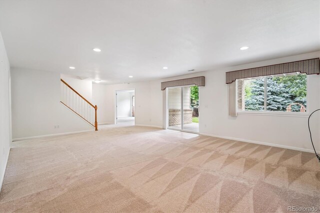 11237 W Ford Dr, Lakewood, CO 80226 - spare room with light carpet, stairway, and recessed lighting