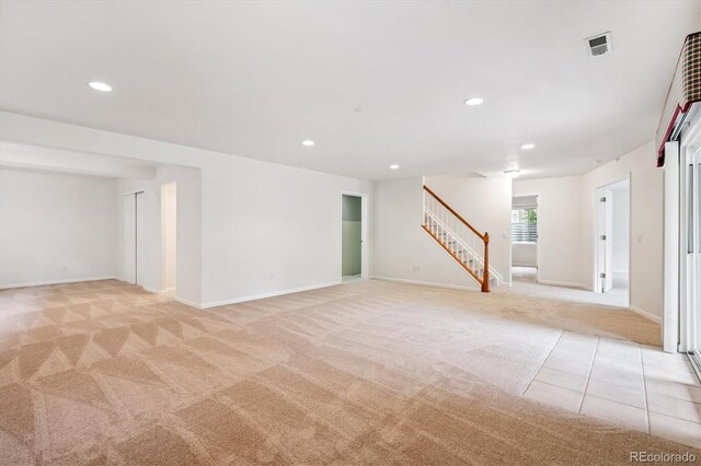 11237 W Ford Dr, Lakewood, CO 80226 - spare room featuring light colored carpet, stairs, and recessed lighting
