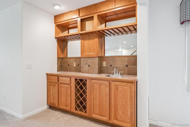 11237 W Ford Dr, Lakewood, CO 80226 - indoor wet bar featuring decorative backsplash and light carpet