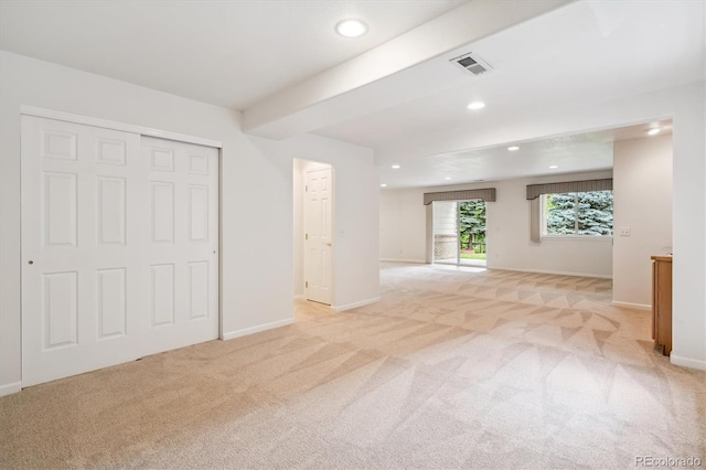 11237 W Ford Dr, Lakewood, CO 80226 - unfurnished living room featuring light colored carpet, recessed lighting, and beamed ceiling