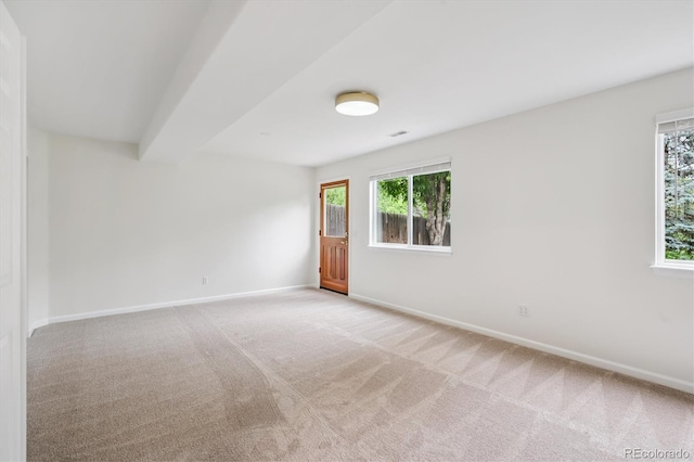 11237 W Ford Dr, Lakewood, CO 80226 - empty room featuring healthy amount of natural light and light colored carpet