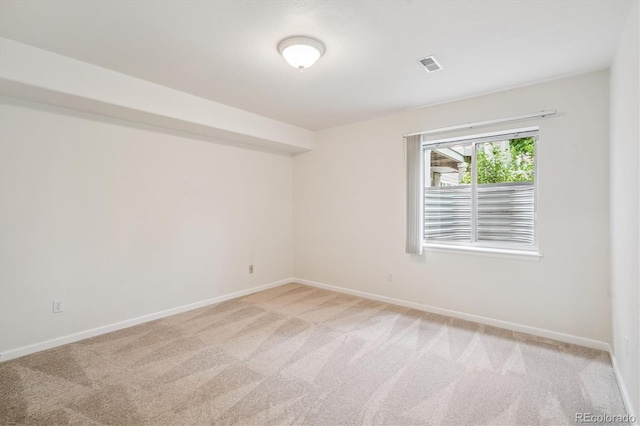 11237 W Ford Dr, Lakewood, CO 80226 - empty room featuring light colored carpet and baseboards