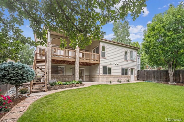 11237 W Ford Dr, Lakewood, CO 80226 - rear view of house featuring brick siding, stairs, and a deck