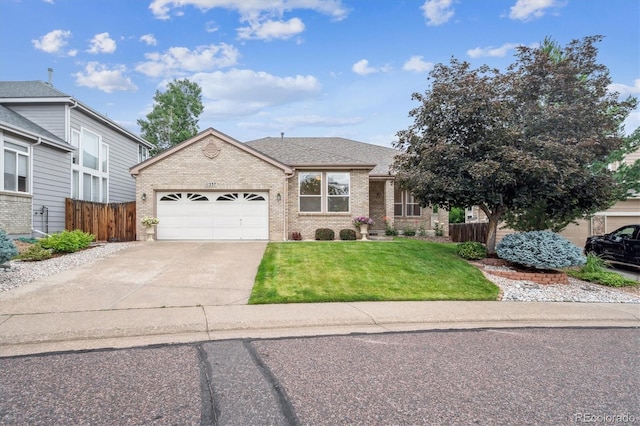 11237 W Ford Dr, Lakewood, CO 80226 - view of front facade featuring brick siding, a garage, driveway, and a shingled roof