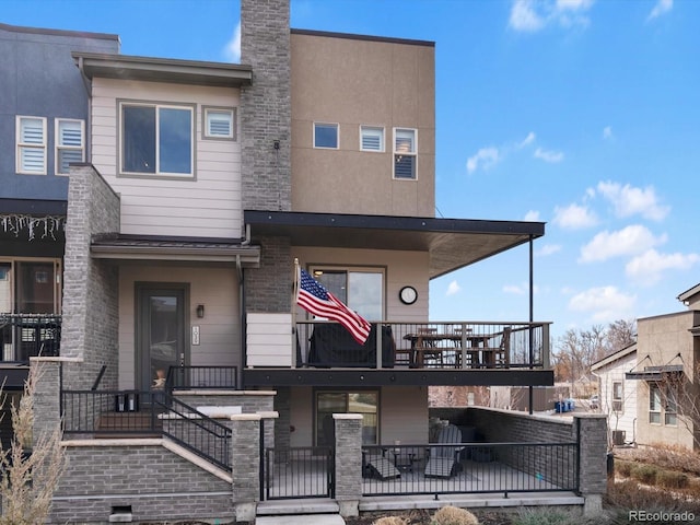 townhome / multi-family property featuring brick siding