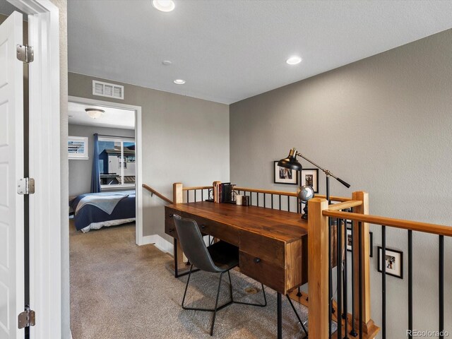 office featuring recessed lighting, carpet, visible vents, and baseboards