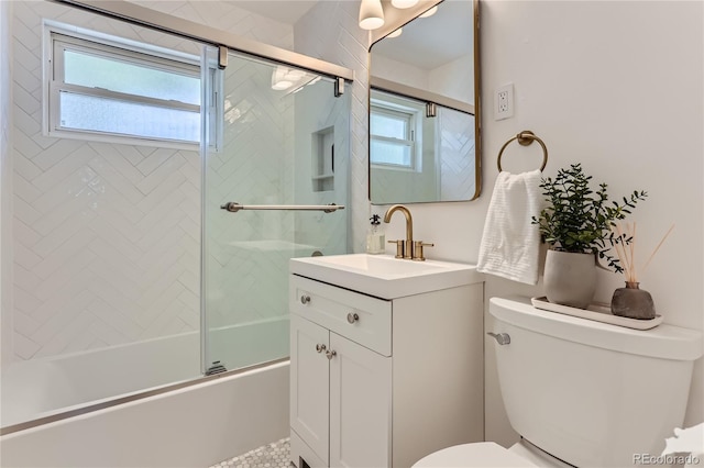 full bathroom with bath / shower combo with glass door, vanity, and toilet