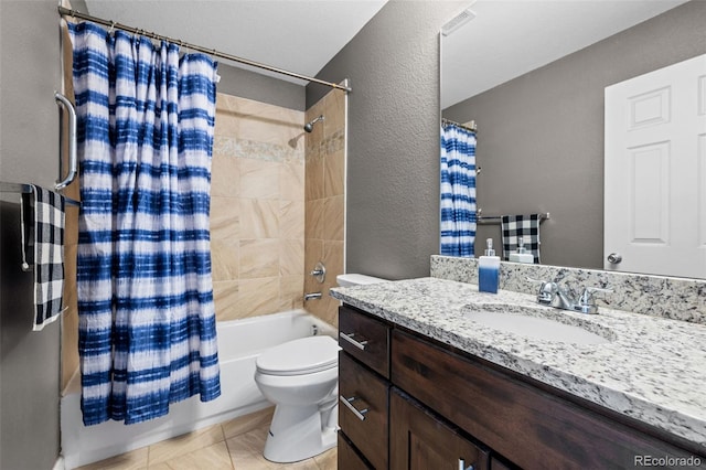 bathroom featuring visible vents, a textured wall, toilet, shower / tub combo, and vanity