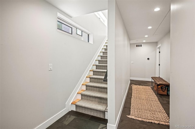 stairs featuring recessed lighting, visible vents, and baseboards