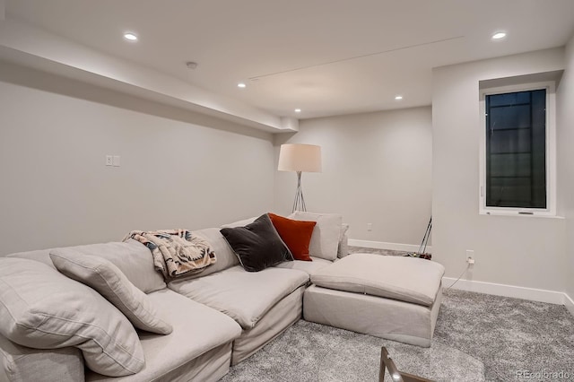 carpeted living area featuring recessed lighting and baseboards