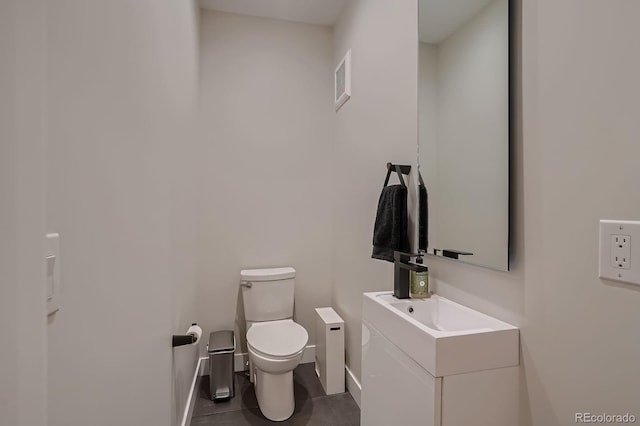 3232 W 16th Ave, Denver, CO 80204 - half bath with toilet, baseboards, and vanity