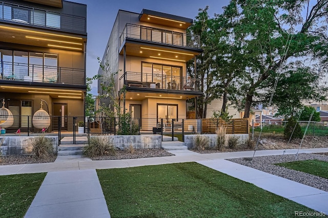 3232 W 16th Ave, Denver, CO 80204 - rear view of property featuring a balcony and stucco siding