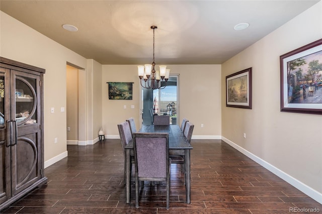 7172 S Oakleaf St, Bennett, CO 80102 - dining area with a chandelier, baseboards, and dark wood finished floors