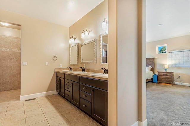 7172 S Oakleaf St, Bennett, CO 80102 - ensuite bathroom with ensuite bathroom, baseboards, a sink, and double vanity