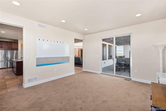 7172 S Oakleaf St, Bennett, CO 80102 - interior space featuring access to outside, stainless steel refrigerator, visible vents, and recessed lighting