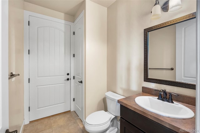 7172 S Oakleaf St, Bennett, CO 80102 - half bathroom featuring toilet, vanity, and tile patterned floors
