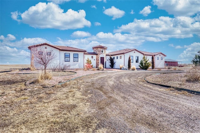 7172 S Oakleaf St, Bennett, CO 80102 - mediterranean / spanish-style house with a tile roof and stucco siding