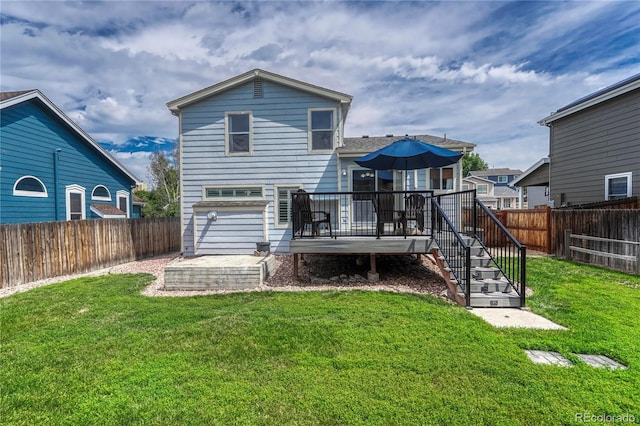 21789 Farmingdale Way, Parker, CO 80138 - back of house featuring a fenced backyard and a deck