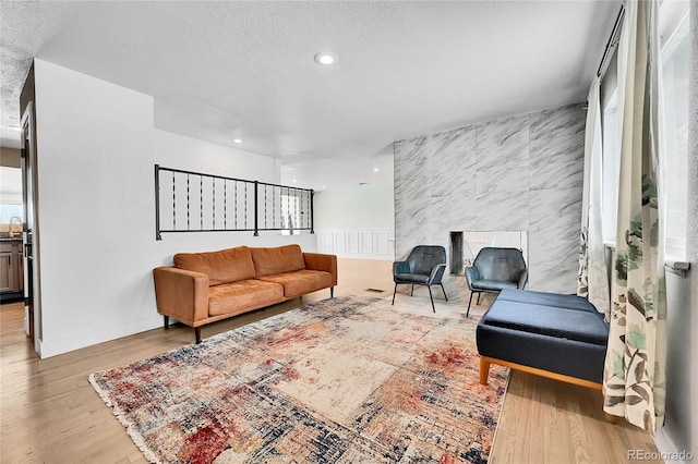 living room with sink and light hardwood / wood-style floors