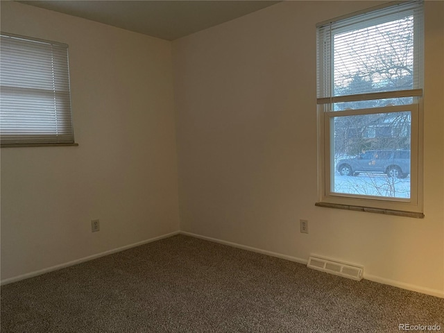 empty room featuring carpet flooring