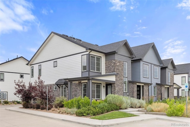 9284 Gore St Unit A, Arvada, CO 80007 - view of home's exterior featuring stone siding