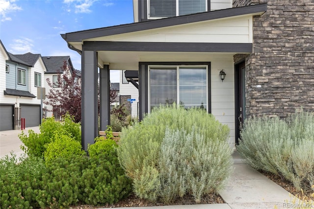 9284 Gore St Unit A, Arvada, CO 80007 - property entrance with a garage and driveway