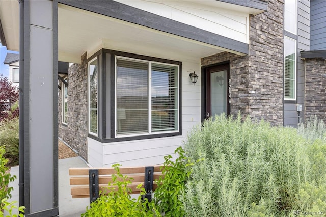 9284 Gore St Unit A, Arvada, CO 80007 - property entrance with stone siding and covered porch