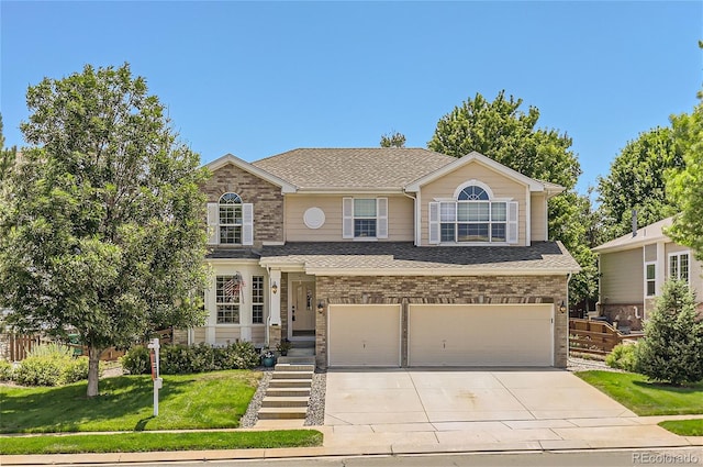 view of front of house featuring a front yard and a garage