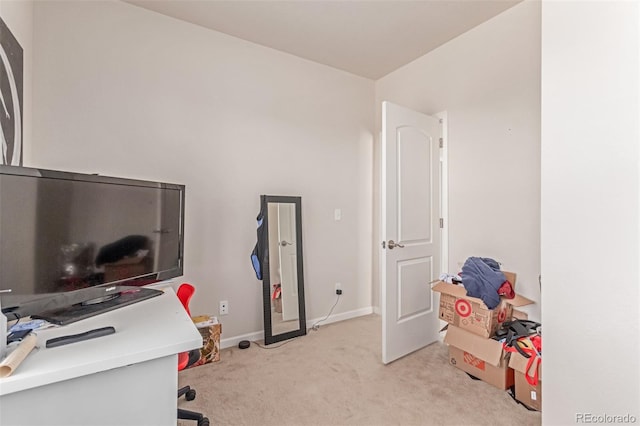 office with light colored carpet and baseboards
