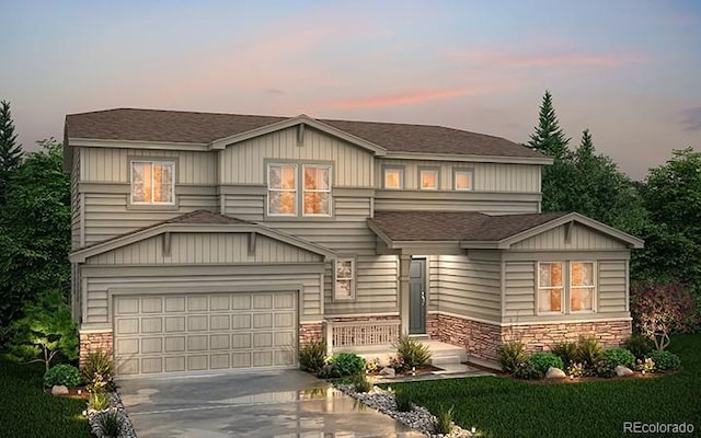 view of front of house featuring driveway, stone siding, a shingled roof, and a garage