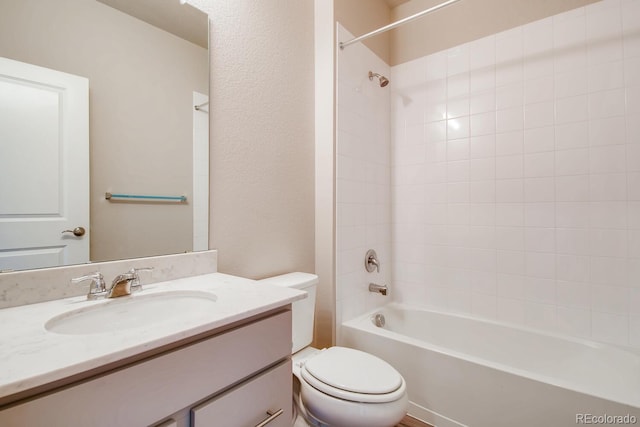 full bath featuring toilet, vanity, and tub / shower combination