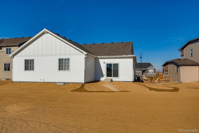 rear view of property with board and batten siding