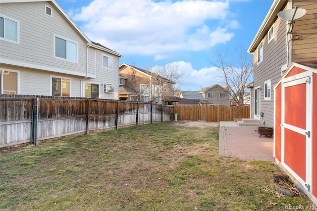 view of yard featuring a fenced backyard and a residential view