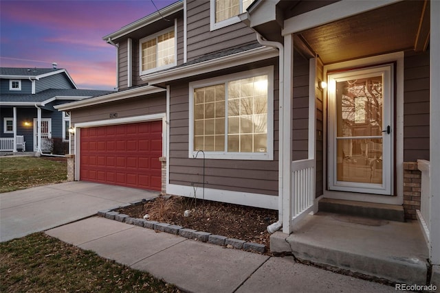 entrance to property with concrete driveway