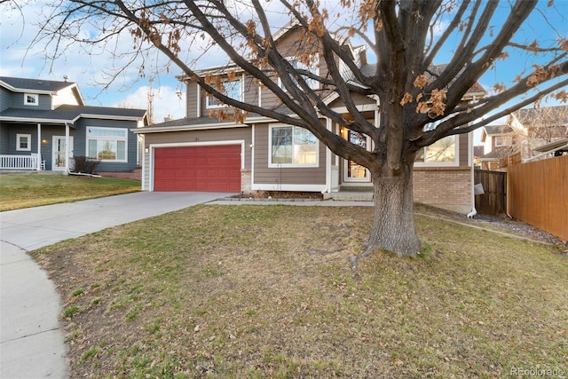 view of front of property featuring concrete driveway, brick siding, a front yard, and fence