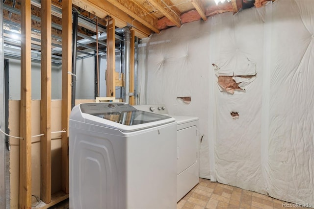 laundry room with washing machine and dryer and laundry area