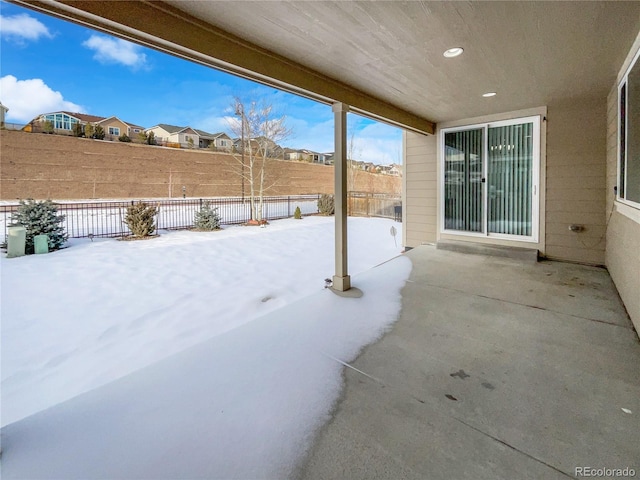 view of snow covered patio