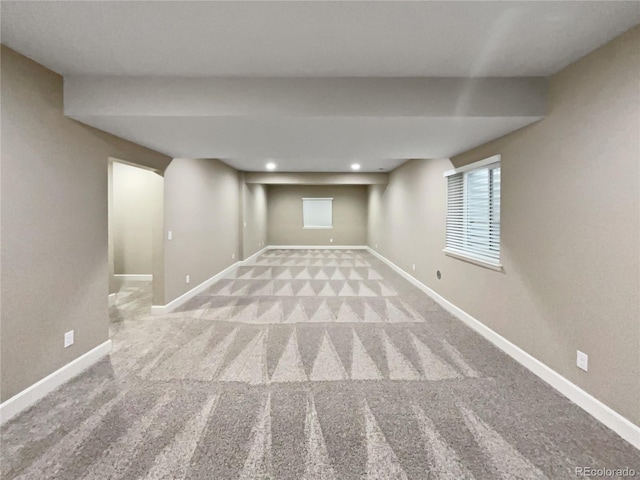 basement featuring light colored carpet