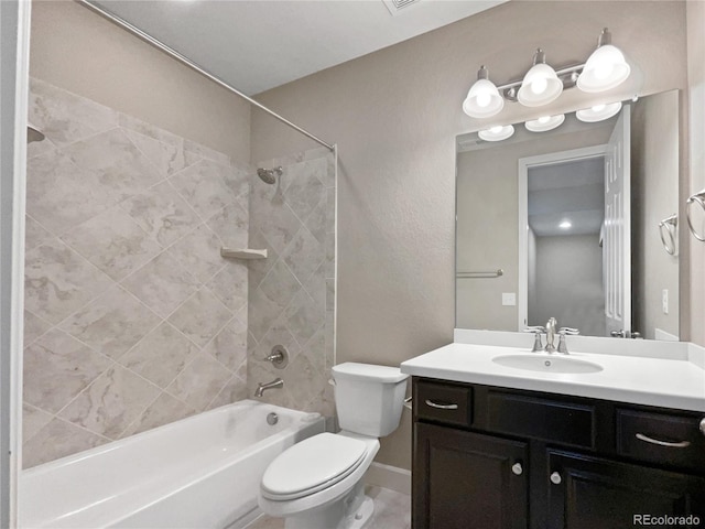 full bathroom with vanity, toilet, and tiled shower / bath combo