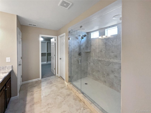 bathroom with vanity and an enclosed shower