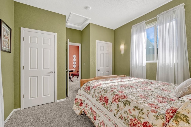 carpeted bedroom with a textured ceiling