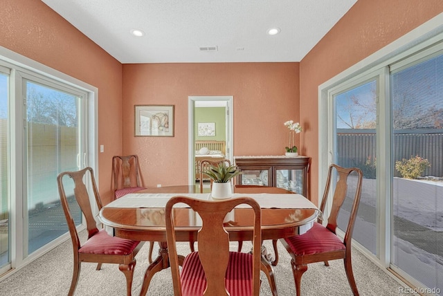 view of carpeted dining area