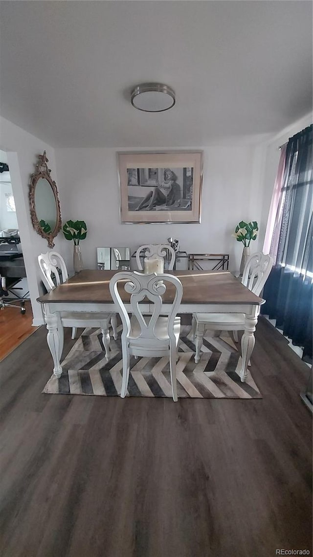 dining room with wood finished floors