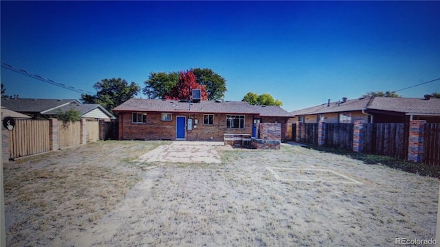 view of front of house with a fenced backyard