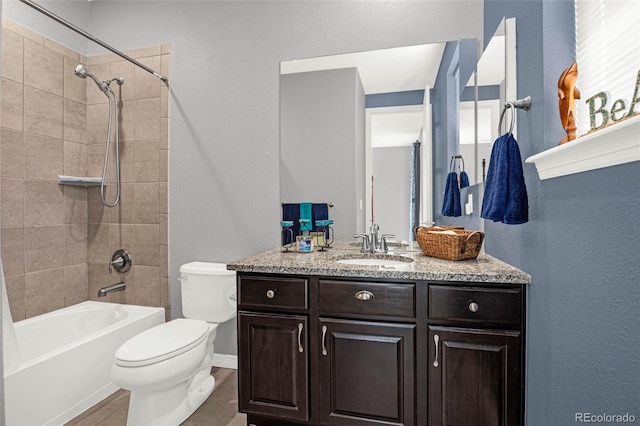 3434 Antelope Ridge Trl, Parker, CO 80138 - bathroom featuring toilet, vanity, tub / shower combination, a textured wall, and baseboards